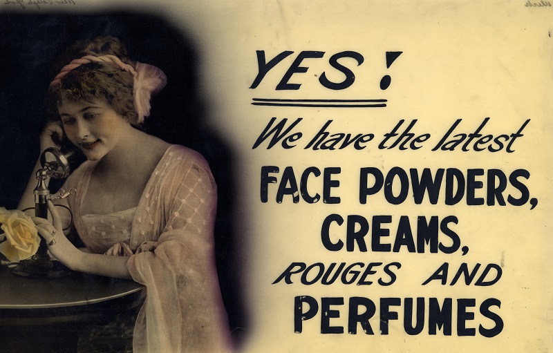 Shop window advertising sign for face powder, creams, rouges and perfumes