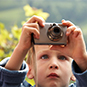 Child holding a camera