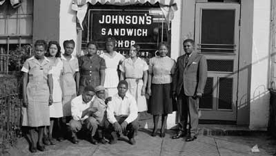 Photo of Group in front of Johnson's Sandwich Shop , ca. 1950