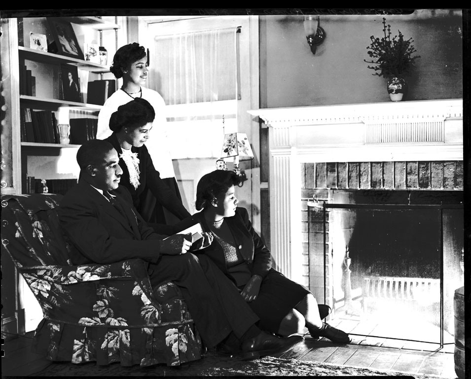 Photo of family looking at fireplace