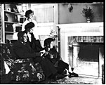 Photo of Family looking at fireplace : cellulose acetate photonegative,
