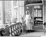 Photo of Dr. Anna J. Cooper in her garden, home & patio, ca. 1930.