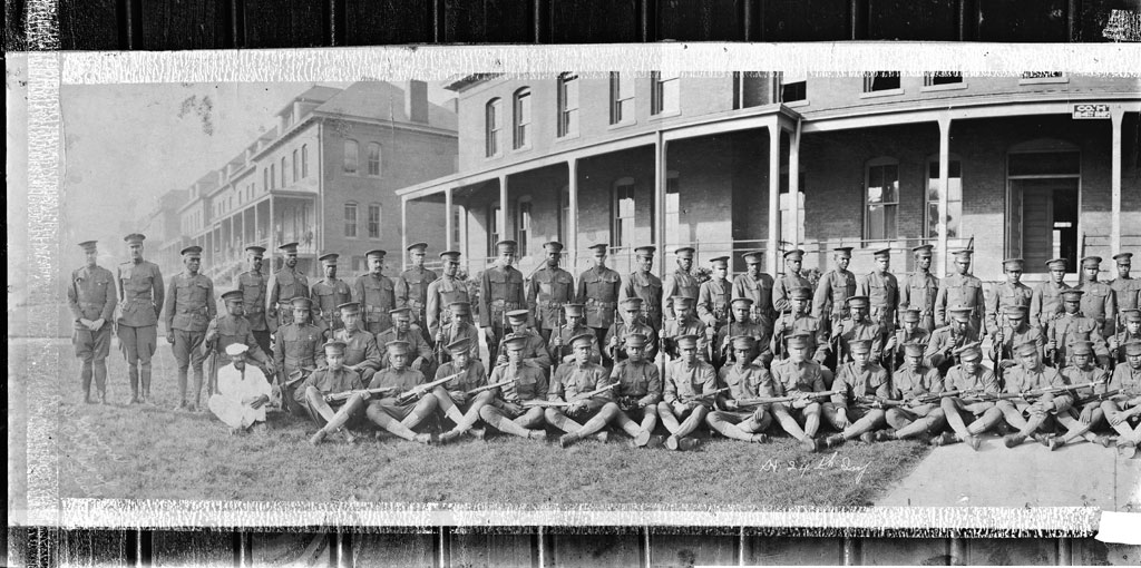 Co. A, 24th Infantry Regiment, panoramic photo comprised of two negatives, company wearing M1918 uniforms, holding 1903 Springfields 