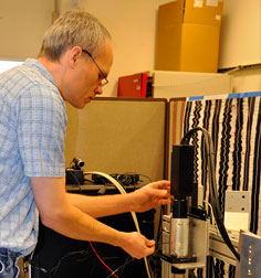 Collaborating scientist Earl Cornell adjusts IRENE to scan a recording from 1881 at Lawrence Berkeley National Laboratory