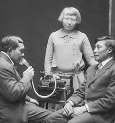 Tule Indians of Panama recording songs on a Dictaphone at the Smithsonian, 1924